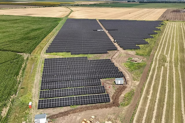Aerial view of CEF Insuratie farm showing rows of panels